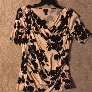 A light pink and black floral top.